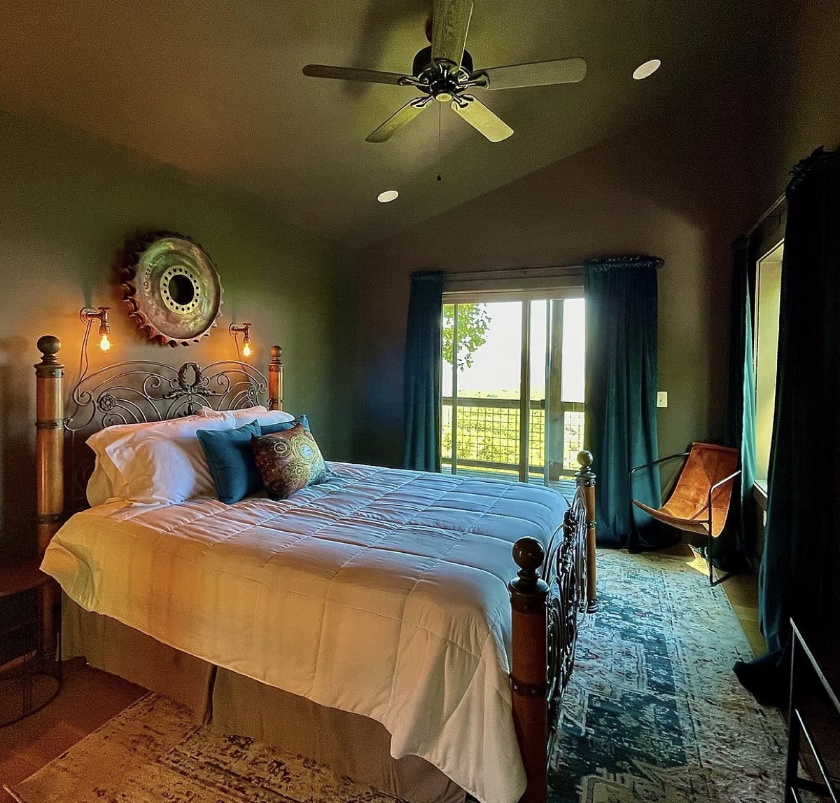 Max bedroom with a wrought-iron bed, industrial lantern, and steampunk details