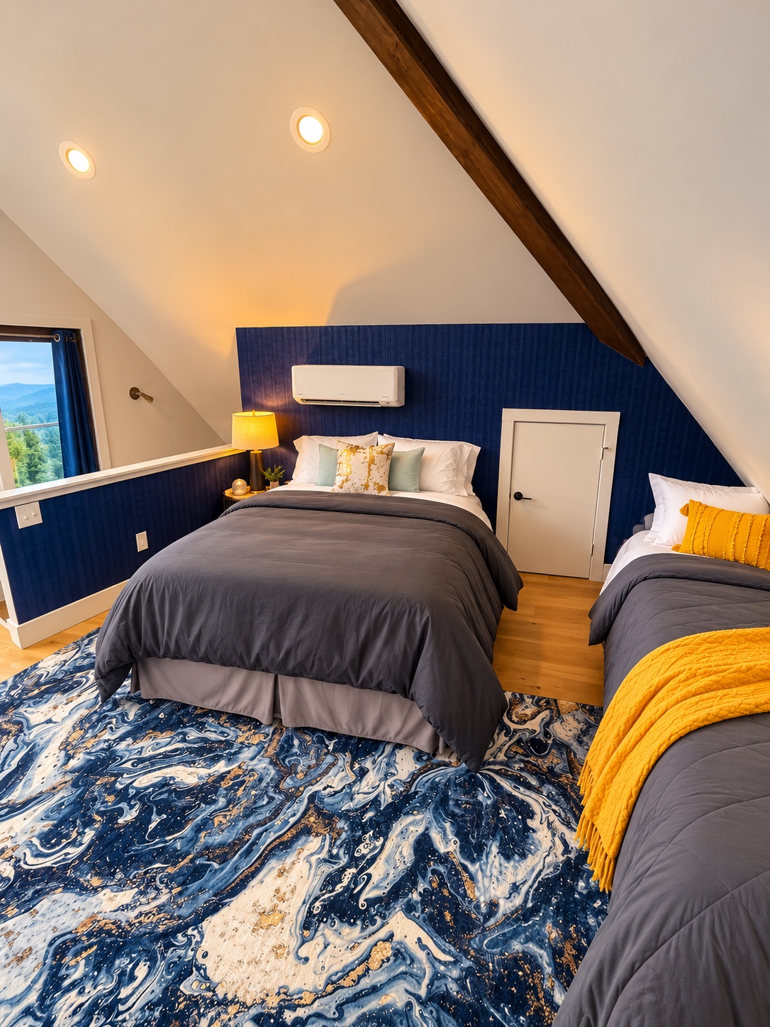 Loft beds with navy walls, gray bedding, and gold accents